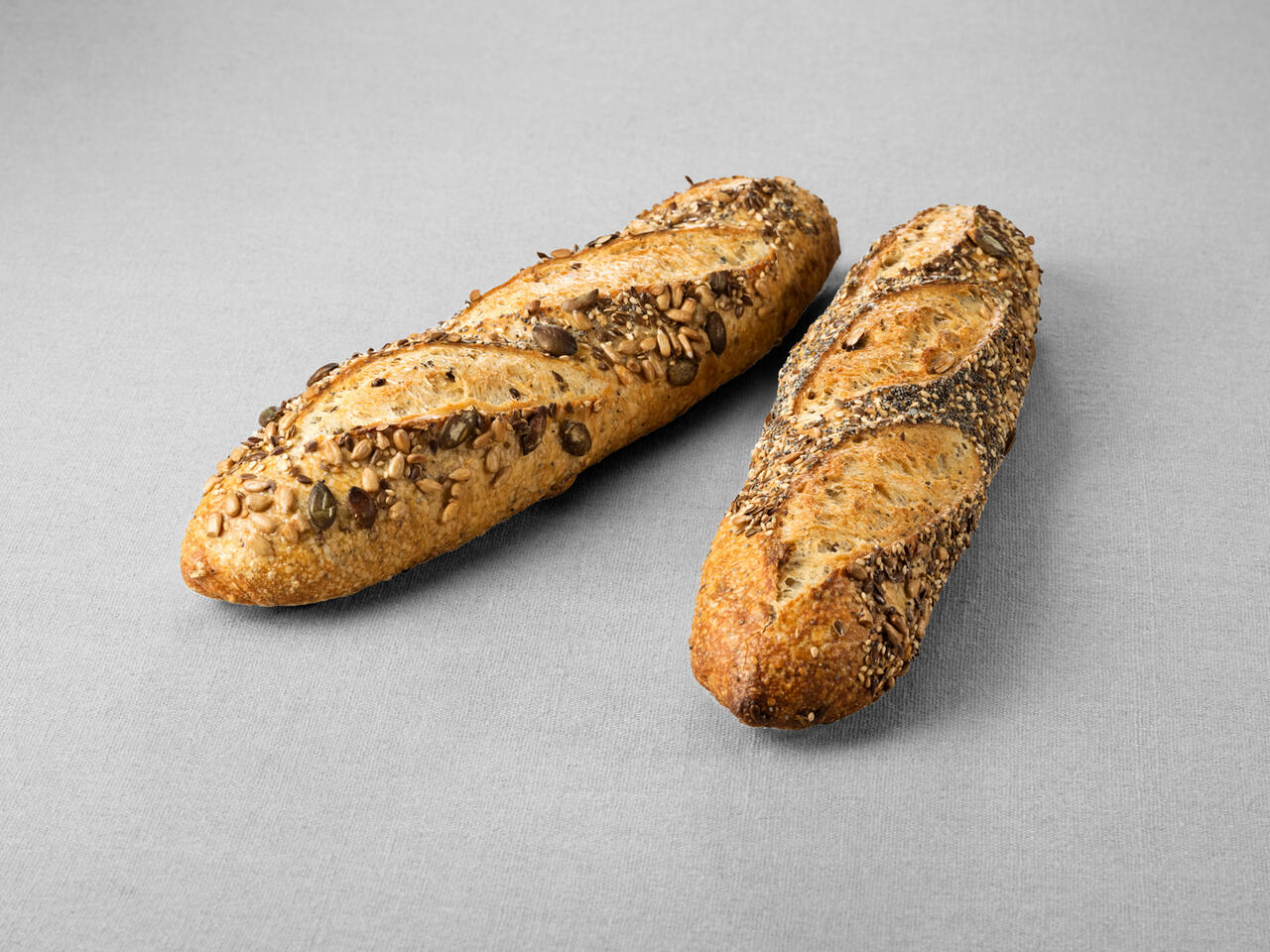 Pain type baguette issu d'une farine de blé blanche au pur levain naturel aux multigraines