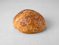 Petit pain issu d'une farine de blé blanche aux graines de lin non moulé au pur levain naturel