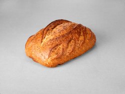 Grand pain issu d'une farine de blé blanche aux graines de lin non moulé au pur levain naturel