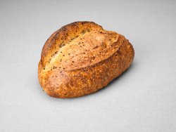 Grand pain issu d'une farine de blé blanche aux graines de lin non moulé au pur levain naturel
