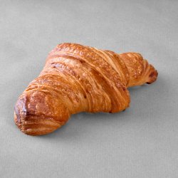 Croissant posé sur un fond gris